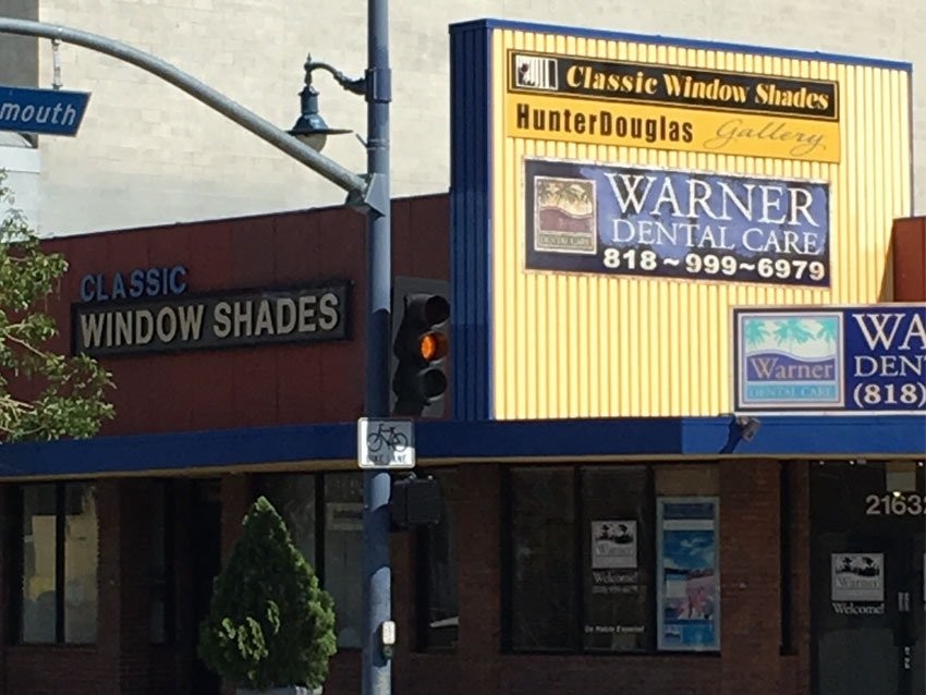 Classic Window Shades storefront on a street corner