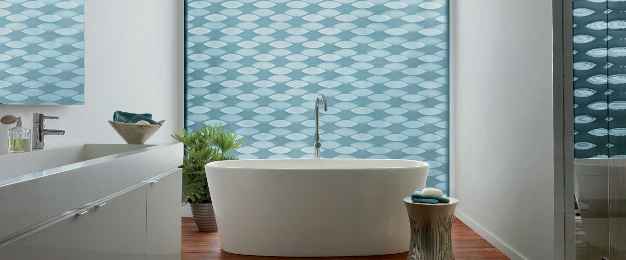 Bathtub in front of blue Designer Banded Shades.